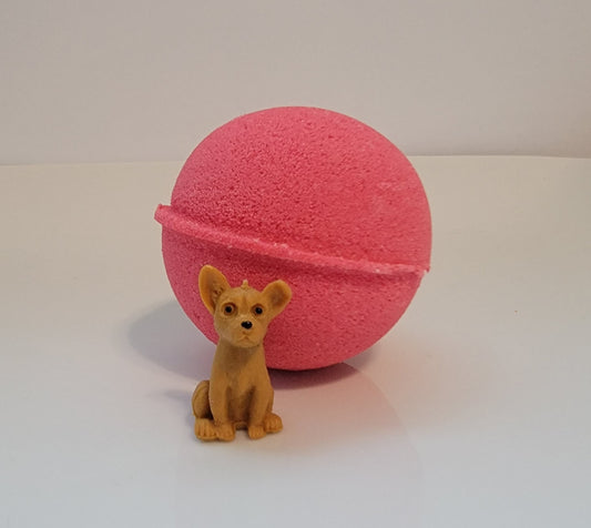 Watermelon scented bath bomb with puppy dog toy inside
