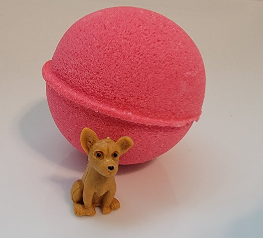 Watermelon scented bath bomb with puppy dog toy inside