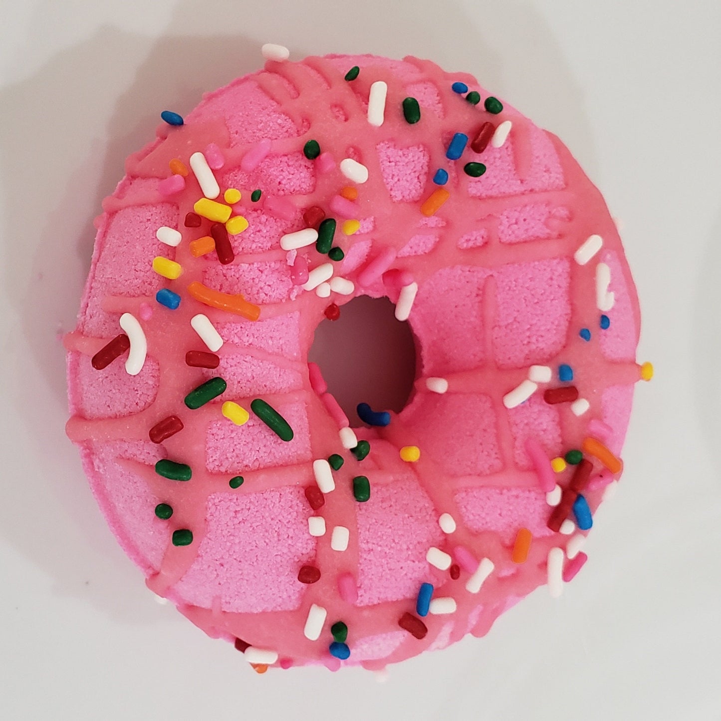 Sour Cherry scented donut bath bomb with frosting and sprinkles